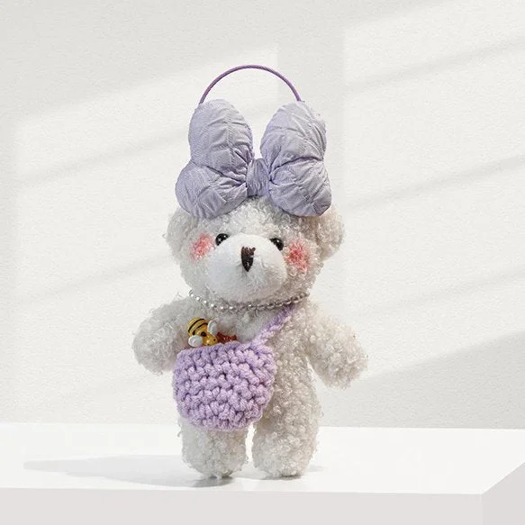 Bijou de sac ours en peluche blanc avec nœud lavande